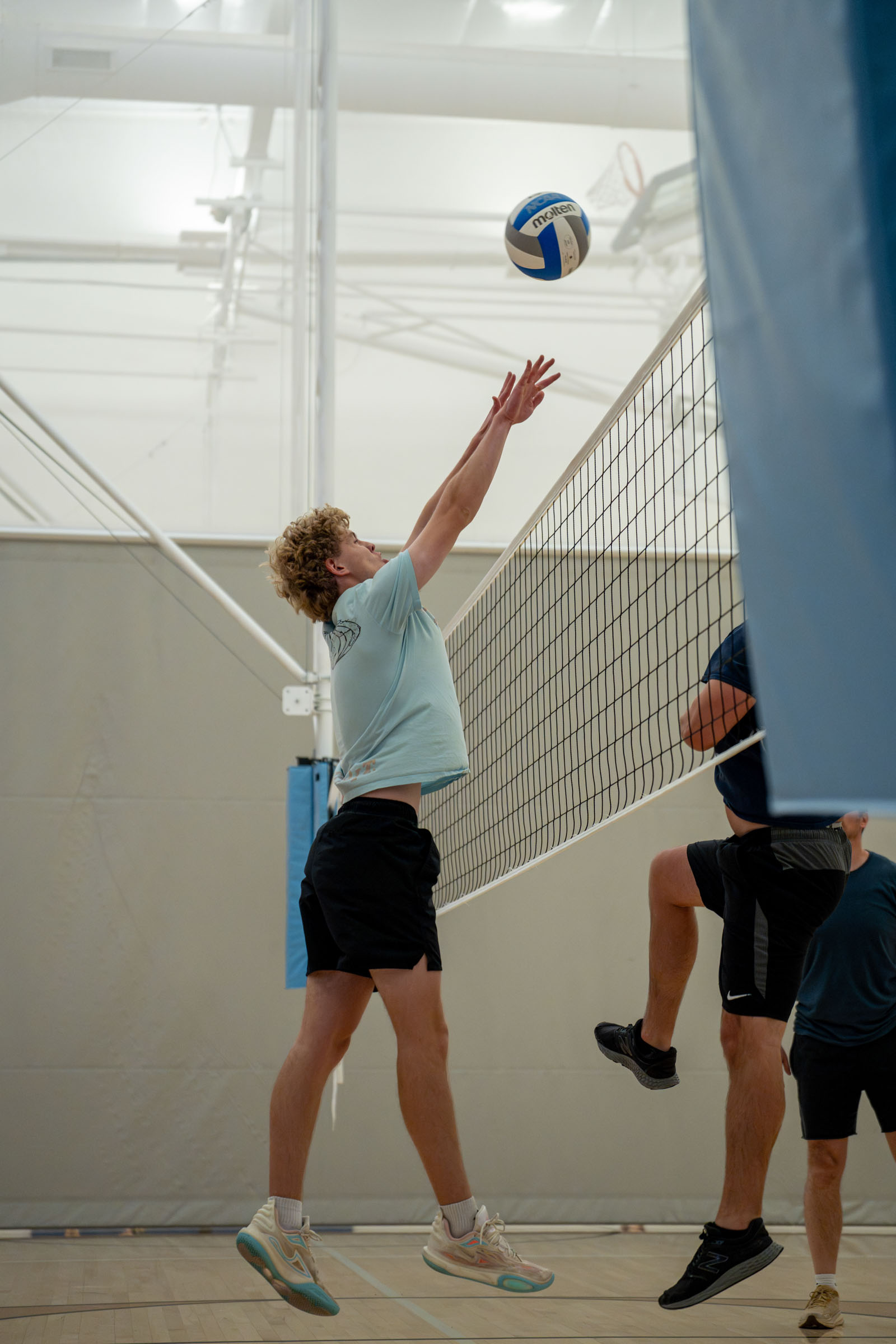 High school volleyball spike, Denver metro